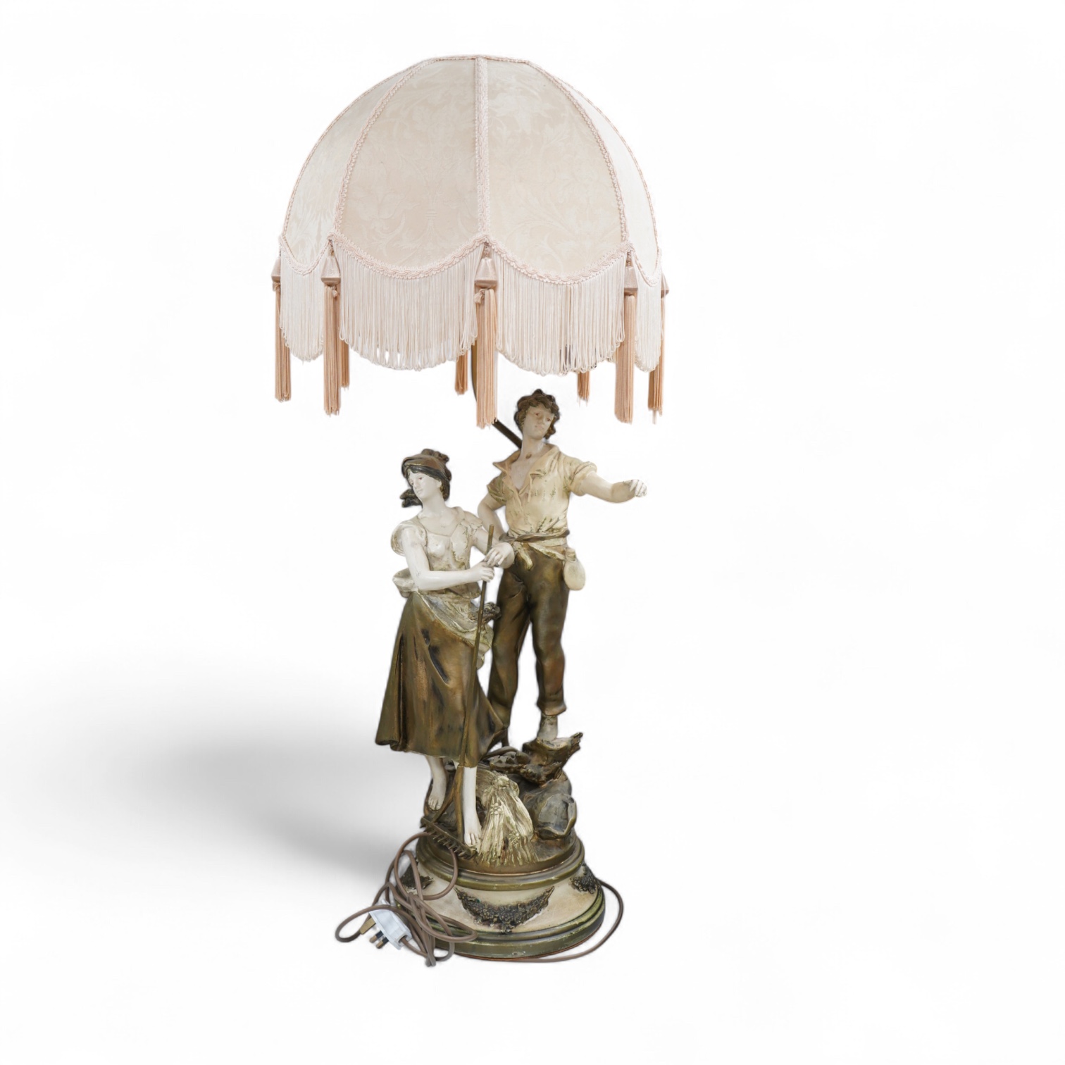 A figural spelter lamp with shade, 90cm high